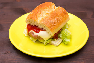 Meatball sandwich and cheese on a wooden table