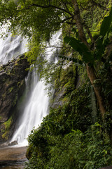 Fototapeta na wymiar Waterfall near trees.
