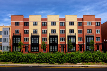 Modern apartment buildings on a sunny day with a blue sky