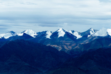 Fototapeta na wymiar Top of snow rock mountains landscape in Leh, Ladakh in India - with copyspace