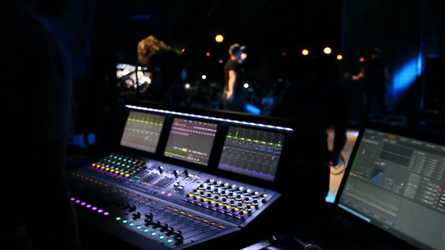 sound engineer work on the audio mixer at a concert
