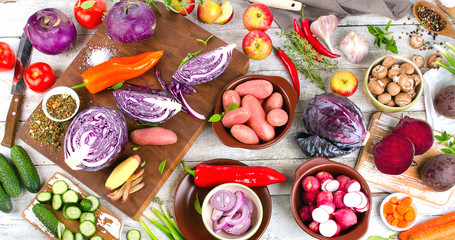 Fresh fruits and vegetables on wooden board.