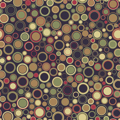 Seamless pattern. Consists of geometric elements having a circular shape and different color, located on black background. Useful as design element for texture and artistic compositions.