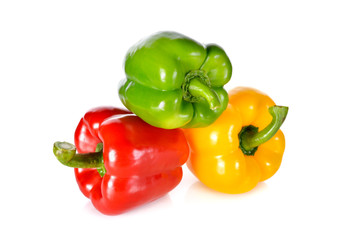 fresh green, red, yellow bell pepper with stem on white backgrou