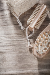 Scrubbing loofah massager bath brush on wooden board spa treatme