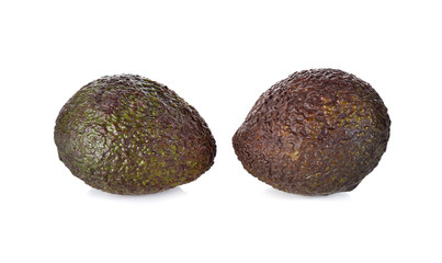 whole ripe avocado on white background