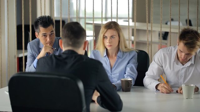 Man is having work interview sitting in office.
