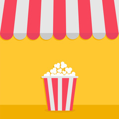 Striped store awning for shop, marketplace, cafe, restaurant. Red white canopy roof. Popcorn big box. Cinema icon. Flat design. Yellow background. Isolated.