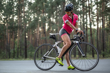 Fototapeta na wymiar Female cyclist outdoors