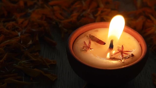 Moving in and out on a jib from a Diya or a tradition lamp used for various Hindu festive celebrations for the festival of light- Diwali and also for other prayers at home or a temple