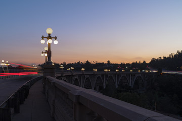 Fototapeta na wymiar The Colorado Street Bridge in Pasadena, California at dusk. The bridge has been designated a National Historic Civil Engineering Landmark. It was part of Route 66 from 1926 through 1940.