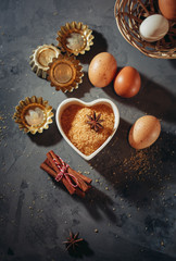 Obraz na płótnie Canvas Brown sugar, eggs, cinnamon sticks and star anise