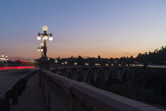 The Colorado Street Bridge in Pasadena, California at dusk. The bridge has been designated a National Historic Civil Engineering Landmark. It was part of Route 66 from 1926 through 1940.