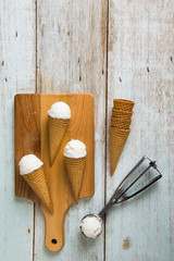 Fototapeta na wymiar vanilla ice cream with preparation, top down view