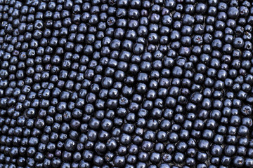 Pile of chokeberry fruits. Fruit background, macro