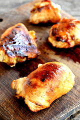 Stuffed cream cheese turkey rolls on a wooden board. Turkey steaks filled and rolled up with a cream cheese and baked in the oven. Tasty and original meat dish. Closeup