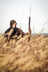 Photo sur Plexiglas Chasser Hunter aiming the hunt during the hunting season