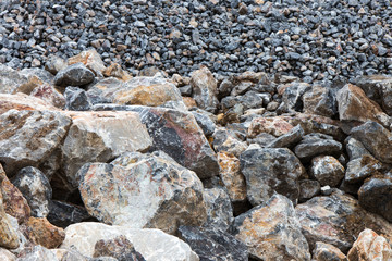 Large and small piles of stones.