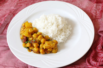 Chickpeas and potato curry served with rice