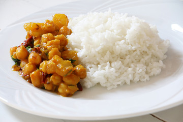 Chickpeas and potato curry served with rice