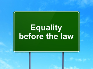 Political concept: Equality Before The Law on road sign background