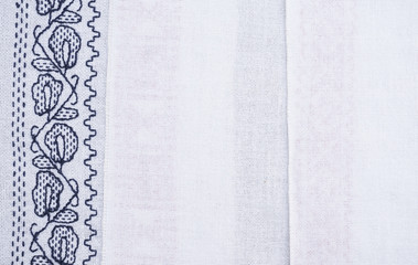 Fragment of hand embroidery on canvas.
