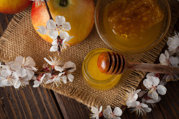 honey dipper and honeycomb. nuts and apples with honey and nuts of various kinds. Healthy natural food for medical and dieting 