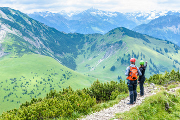 Fototapeta na wymiar Hiker in beautiful landscape of Alps in Germany - Hiking in the