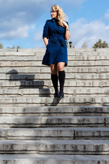 Girl in In Blue Coat On Stairs