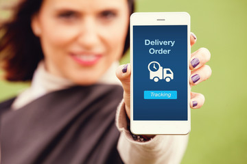 Shipment tracking app. Woman holding a smart phone with delivery order information in the screen.