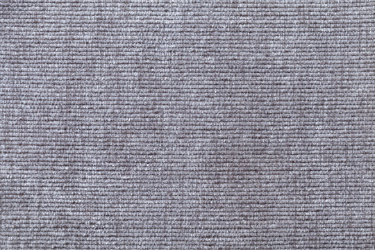 Light gray background from soft textile material. Fabric with natural texture.