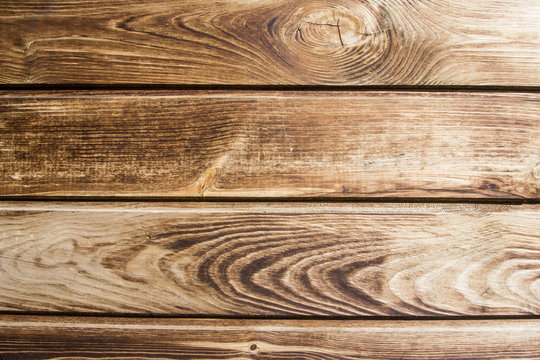 Brown wooden desk background.