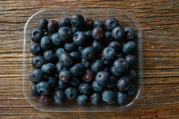 Blueberries fruits on a wooden board table