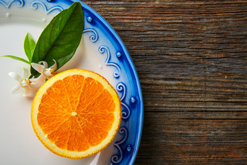 Cut open orange fruit with orange flower