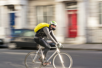 Motion blur of man ridding bicycle