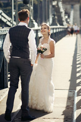 Naklejka premium Happy newlyweds on the street