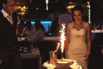 Stylish happy bride and groom