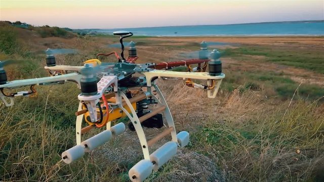 Custom hexacopter drone flies in the sky. Slow motion.