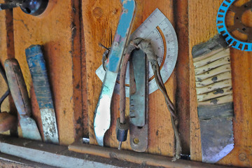 old tools on the wall of the barn