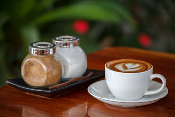latte art coffee on wood table