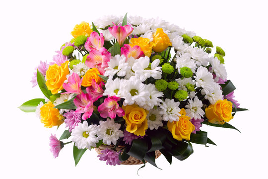 Flower arrangement in a basket - lstroemeria, rose, chrysanthemum, aspidistra