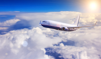 Airplane with blue sky and clouds on background