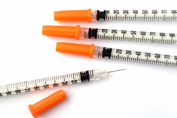 Close-up syringes for insulin on white background