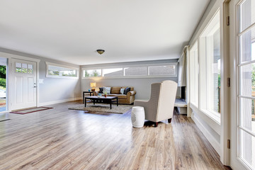 Spacious living room interior with polished hardwood