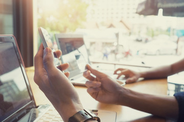 Online payment,Man's hands holding a credit card and using smart
