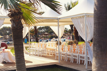 Fototapeta na wymiar A lot of wedding chairs and luxurious tent