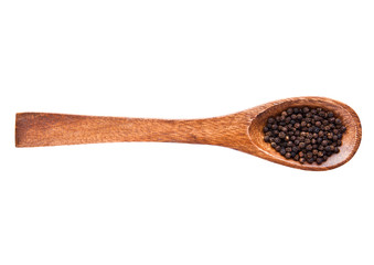 Black pepper on wooden spoon isolated on white background