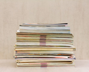 a large stack of magazines close-up, front view