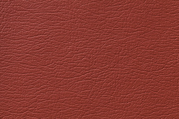 Orange leather texture background with pattern, closeup.
