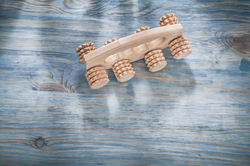 Wooden massager on wood board healthcare concept